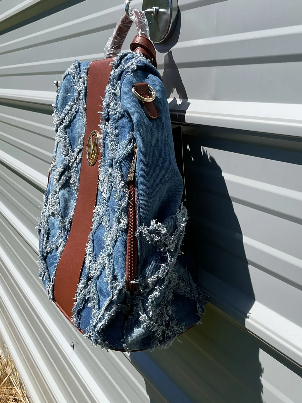 Denim Fringe Quilted Backpack with Brown Trim